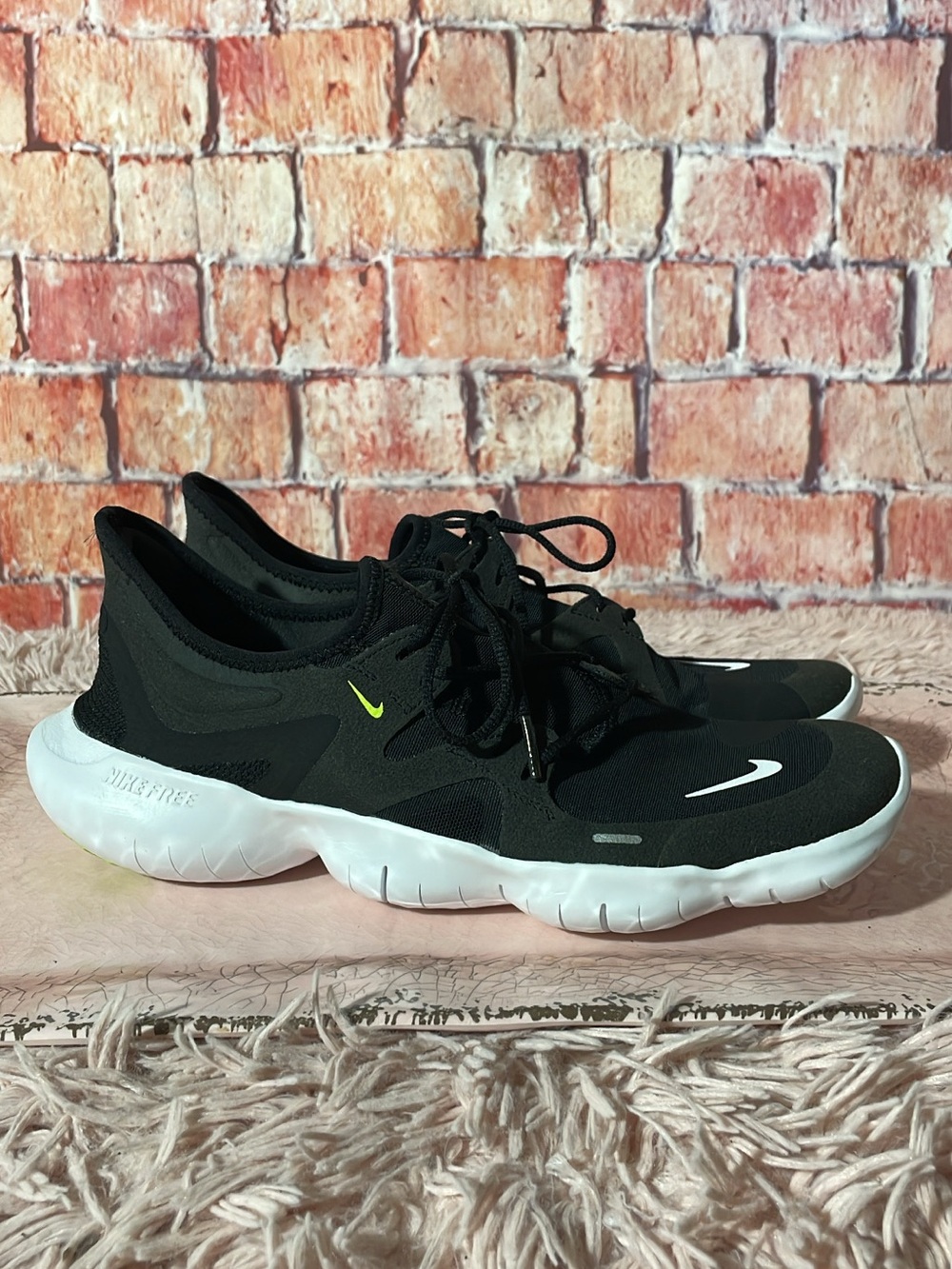Nike Women’s Black and White Lightweight Training Sneakers with Lime Accent